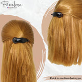 Hair clip in blonde hair with 'Parcelona' branding on a light background