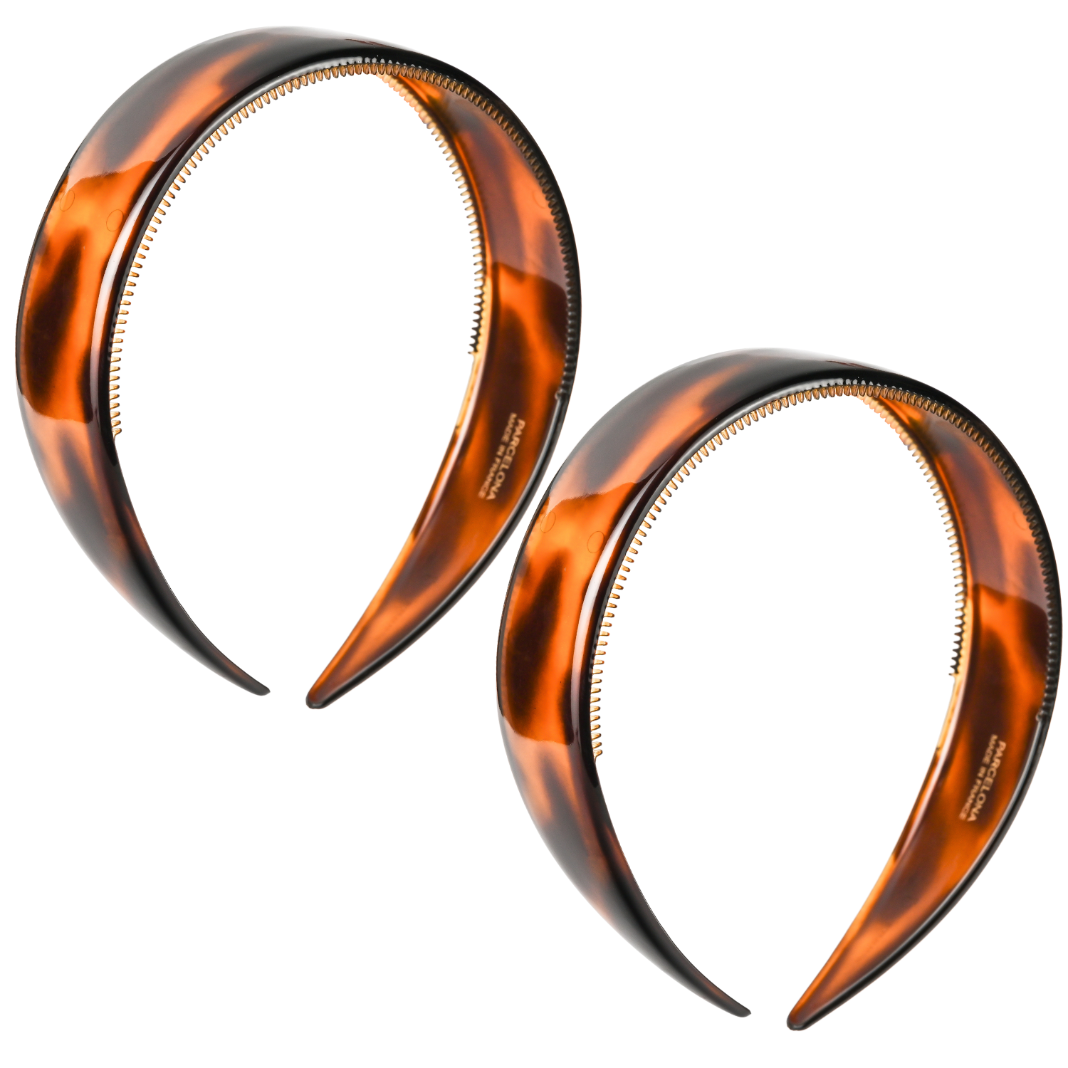 Two tortoiseshell headbands on a white background