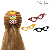 Cat-eye hair clips in various colors on a head with 'Parcelona' branding.