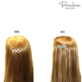 Two hairstyles with white and blue hair clips on a white background, featuring the 'Parcelona' brand.