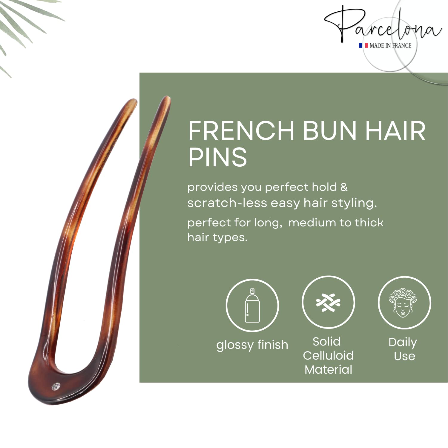 French bun hair pin with green label detailing product features on a white background