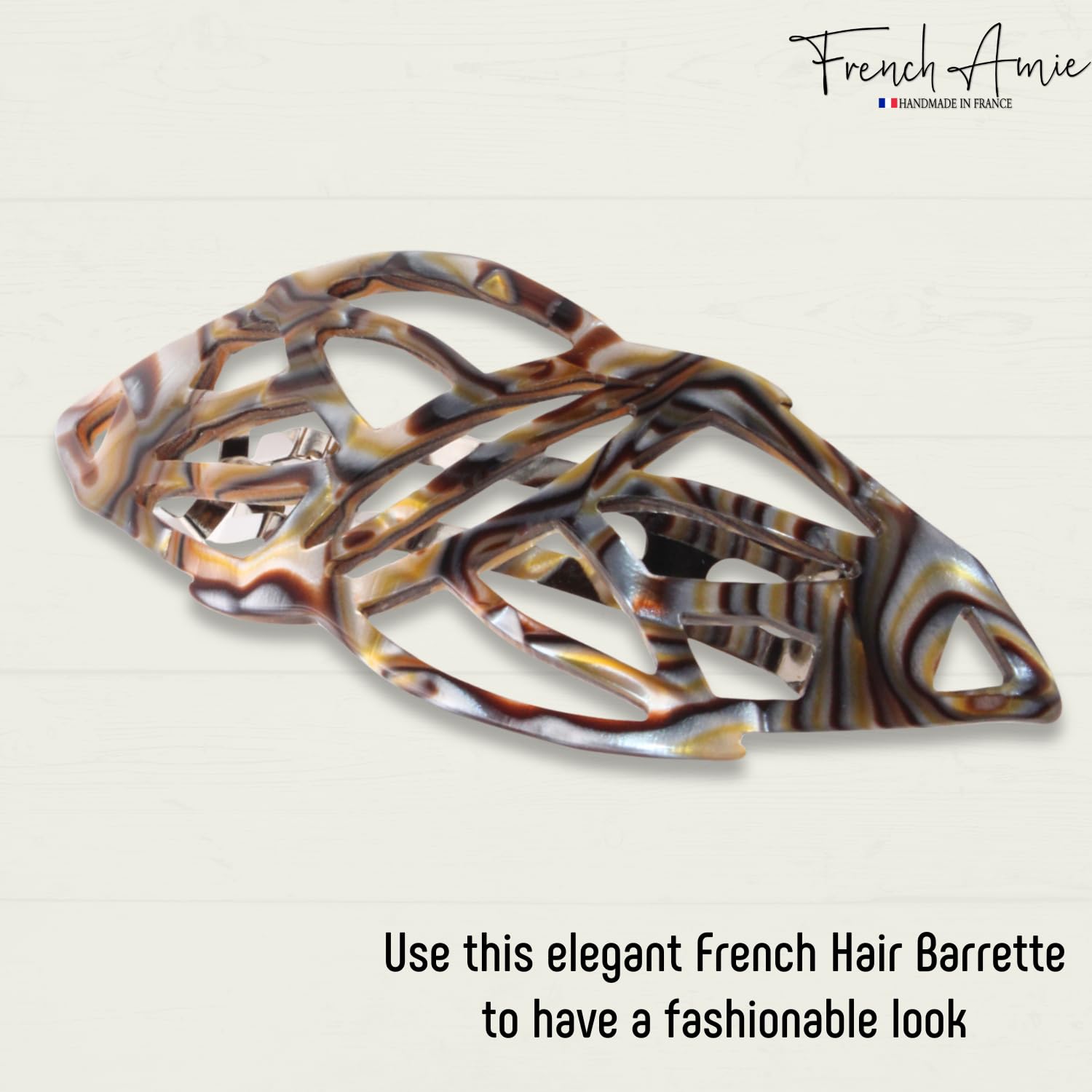 Elegant onyx-patterned French hair barrette on a light beige background with 'French Amie' branding.