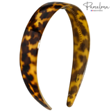 Angled view of Parcelona tortoise acetate headband with logo, 1-inch wide