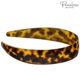 Side view of tortoise 1-inch French acetate headband showing inner teeth