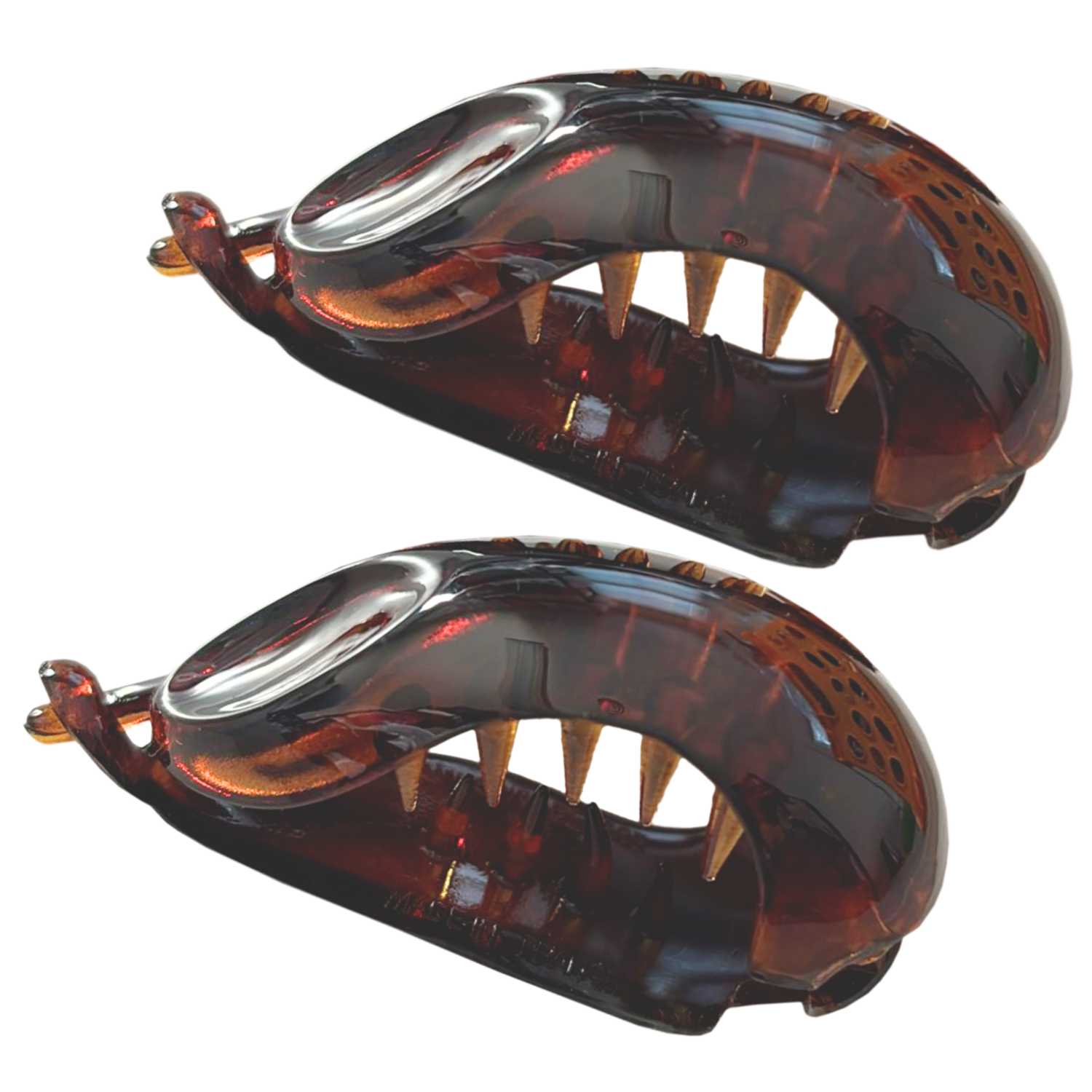Two tortoiseshell hair clips on a white background