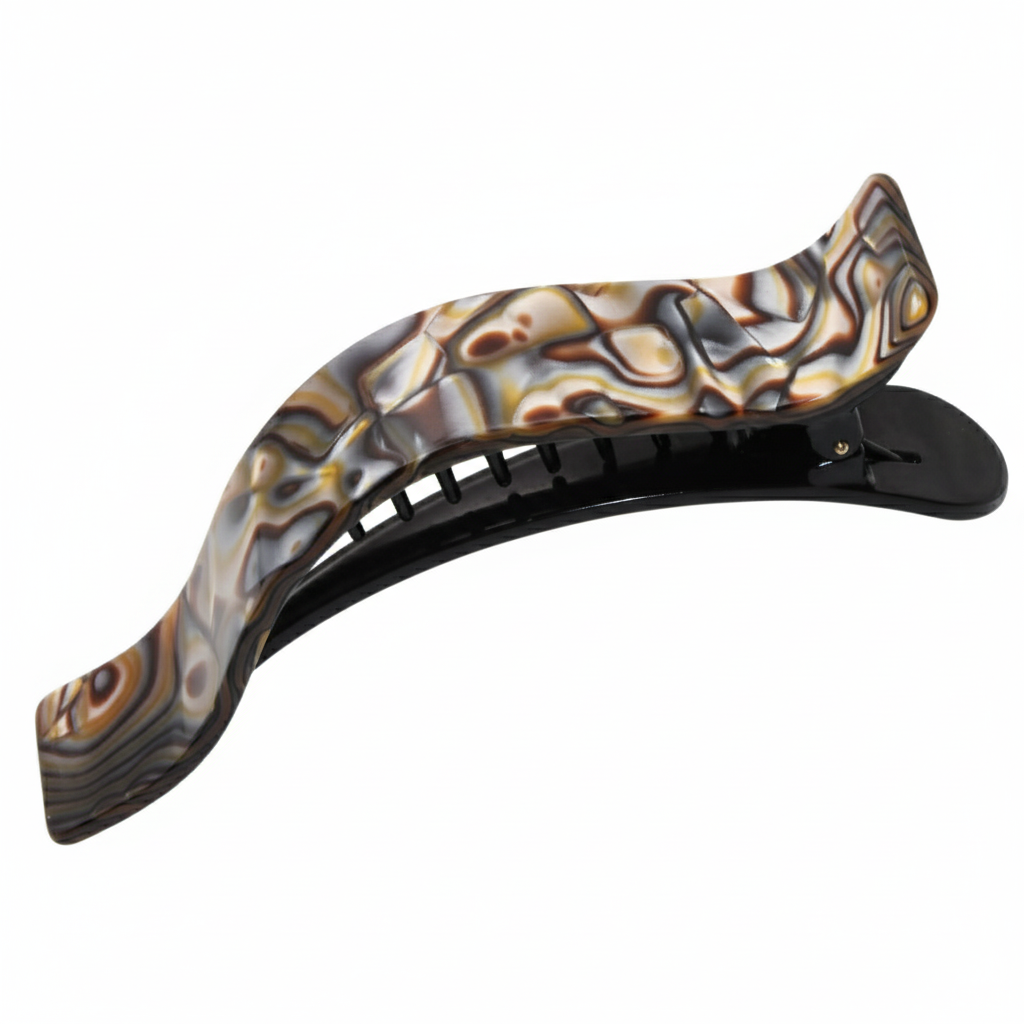 Decorative hair clip with a wavy design on a white background