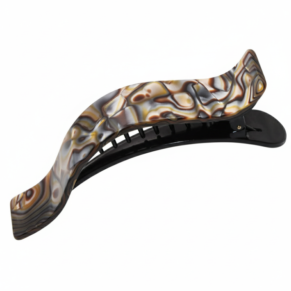 Decorative hair clip with a wavy design on a white background