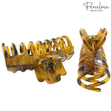 Large hair clips on a white background with 'Parcelona' branding.