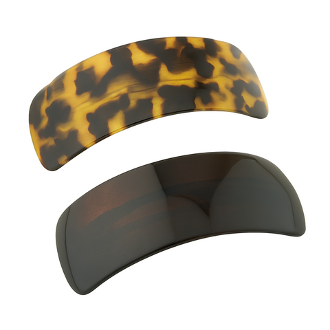 Two tortoiseshell patterned hair clips on a white background