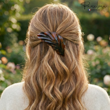 model with wavy hair wearing a tortoiseshell hair clip