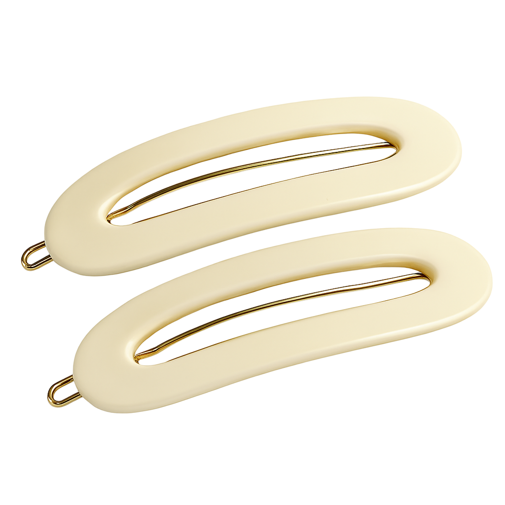Two Ivory-colored hair clips with gold hardware on a white background