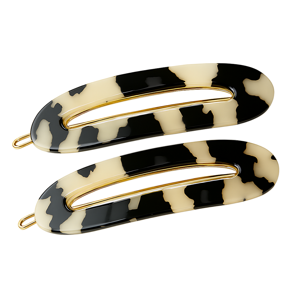 Two patterned hair clips with gold hardware on a white background