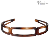 Brown tortoiseshell headband on a white background with 'Parcelona' branding.
