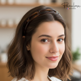 Woman wearing a brown headband with a blurred indoor background