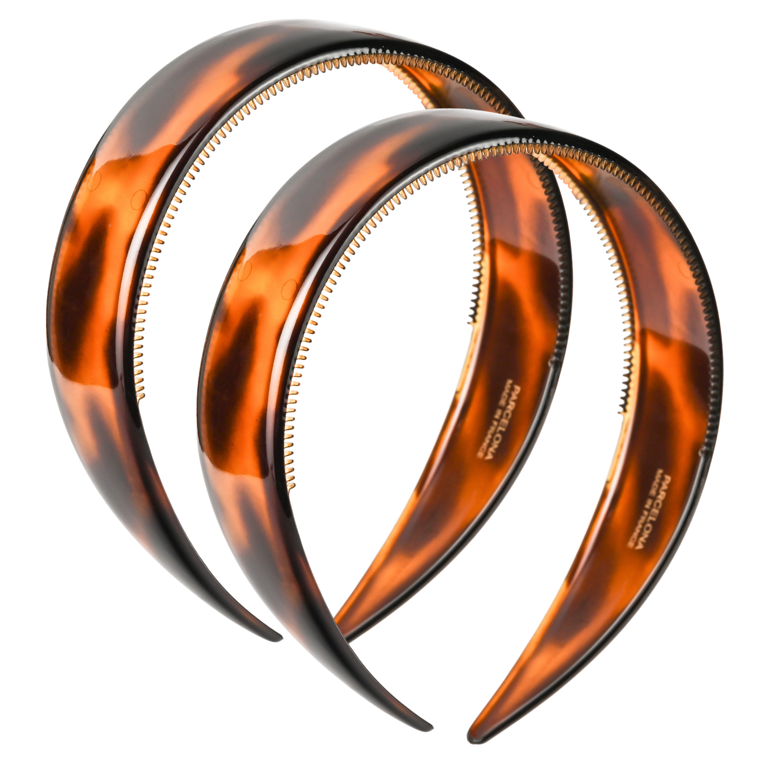 Two tortoiseshell headbands on a white background