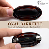Brown oval barrette held by a hand with 'Parcelona' branding, on a white background.