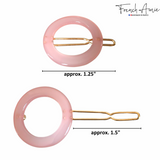 Two pink hair clips with gold hardware, showing measurements on a white background.