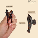 Measurement view of dolphin hair claw showing length 2.25 inches and width 1.25 inches