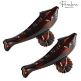 Side view of dolphin-shaped French acetate hair clip with visible clasp teeth