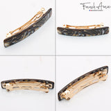 Gold and tortoiseshell hair clip on a white background with 'French Amie' branding.