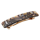 Onyx patterned hair clip with gold accents on a white background