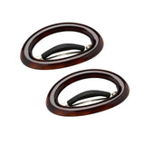 Two tortoiseshell hair clips on a white background