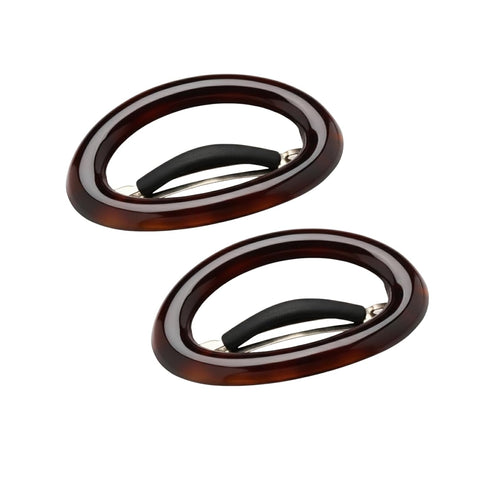 Two tortoiseshell hair clips on a white background