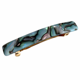 Marbled patterned hair clip on a white background