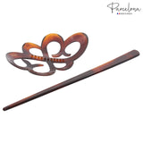 Tortoiseshell hair comb and paddle on a white background with 'Parcelona' branding.
