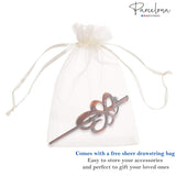 Hair accessory in a sheer drawstring bag with 'Barcelona' branding.