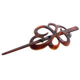 Brown hair clip with a unique design on a white background