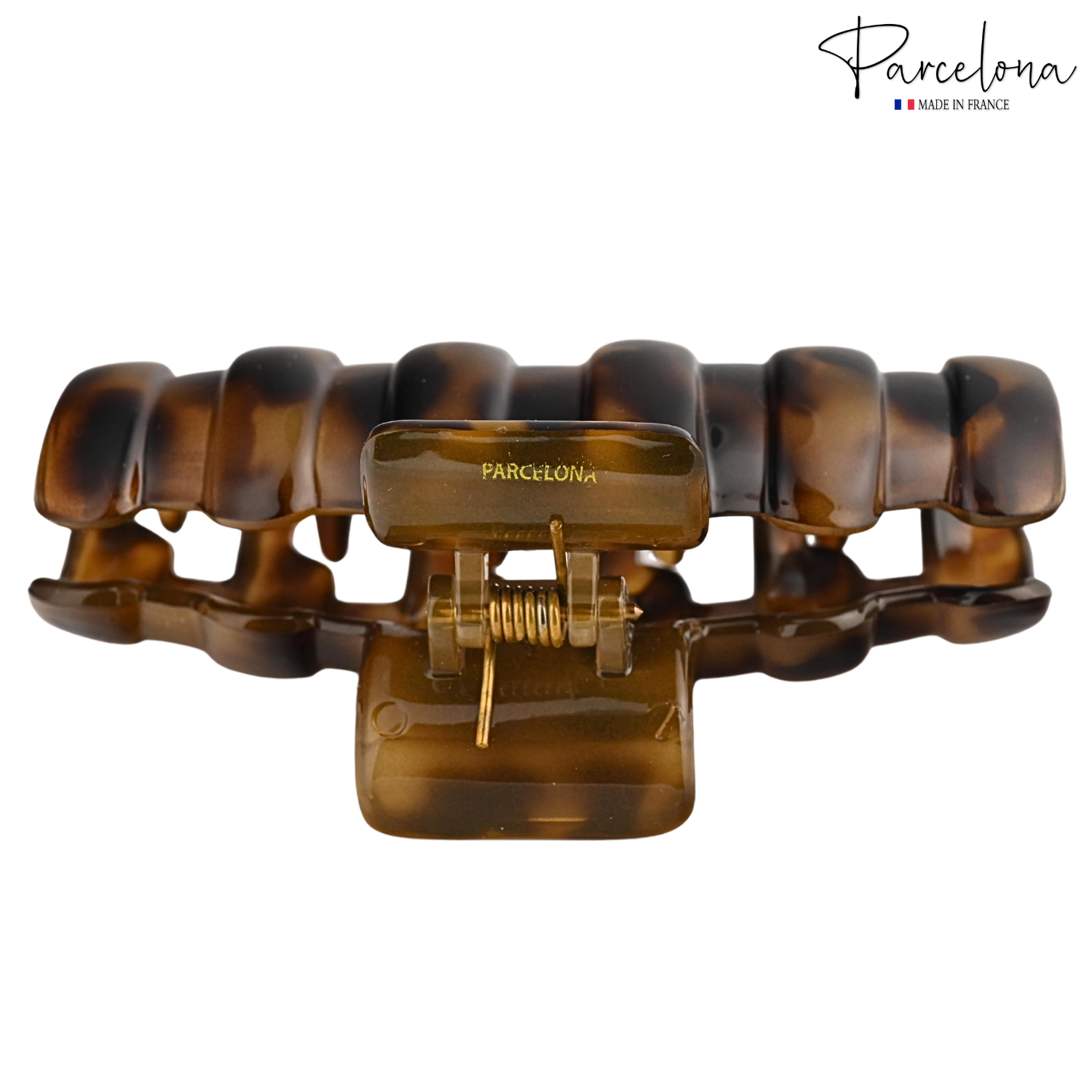Brown tortoiseshell hair clip with gold accents on a white background, featuring the Parcelona brand.