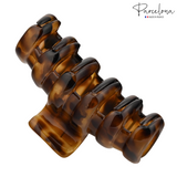 Brown tortoiseshell hair clip on a white background with 'Parcelona' branding.