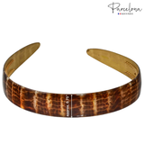 Brown crocodile-patterned headband with gold accents on a white background, featuring the 'Parcelona' brand.