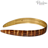 Gold and brown headband with 'Parcelona' branding on a white background