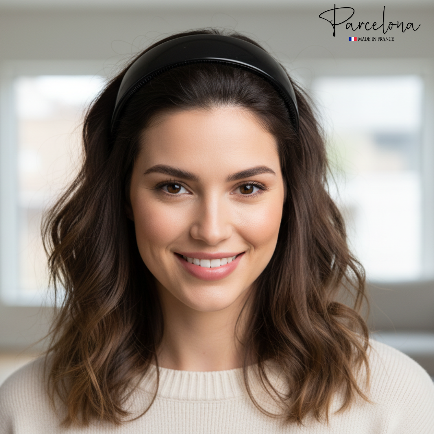 A woman wearing a black headband with 'Parcelona' branding in the corner.