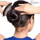 Model demonstration using the Parcelona French twisted hair stick for a bun