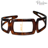 Front view showing 1.5-inch width on Parcelona tortoise open-geometric acetate headband