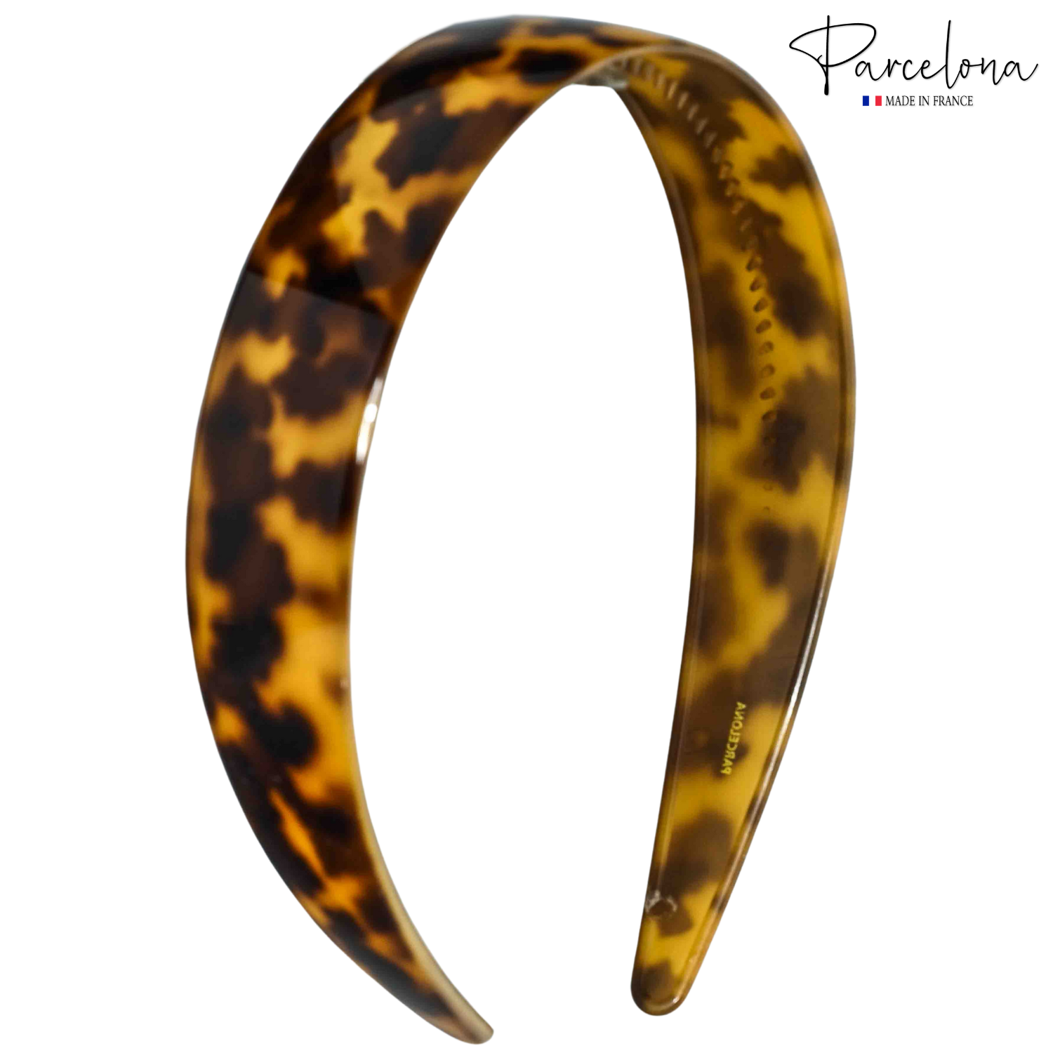 Angled view of Parcelona tortoise acetate headband with logo, 1-inch wide