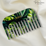 Hair comb with green leaf pattern on a white background, featuring the brand 'Parcelona'.