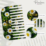 Comb with daisy pattern and 'Parcelona' branding, featuring rounded prongs.