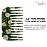 Detangler comb with floral design and text about its benefits on a white background