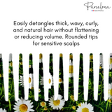 Hair comb with daisy flowers on a white background, featuring text about hair care.
