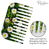 Hair comb with daisy pattern and 'Parcelona' branding on a white background