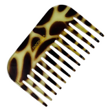 Giraffe print -patterned comb on a white background