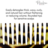 Hair comb with giraffe pattern on a white background, featuring text about hair care.