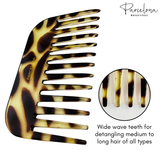 Giraffe print comb with wide, wavy teeth, brand 'Parcelona' visible, on a white background.