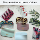 Collection of combs with various designs and colors on a light background