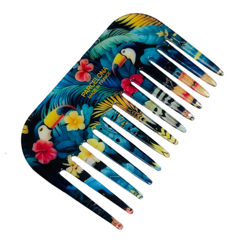 Colorful comb with tropical design on a white background