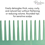 Green comb with text about hair care on a white background